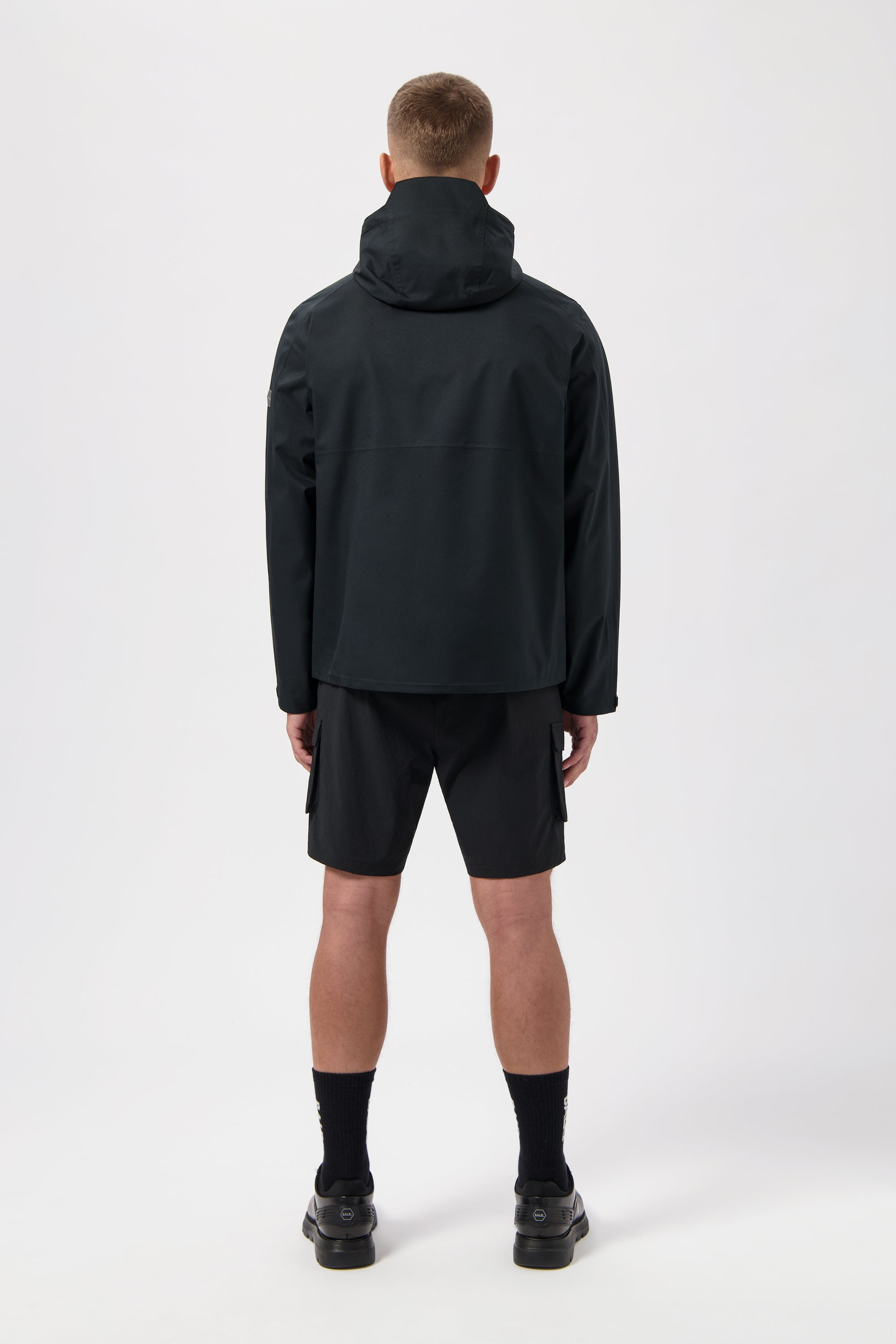 Hex Chaqueta para lluvia de insignia Jet Black