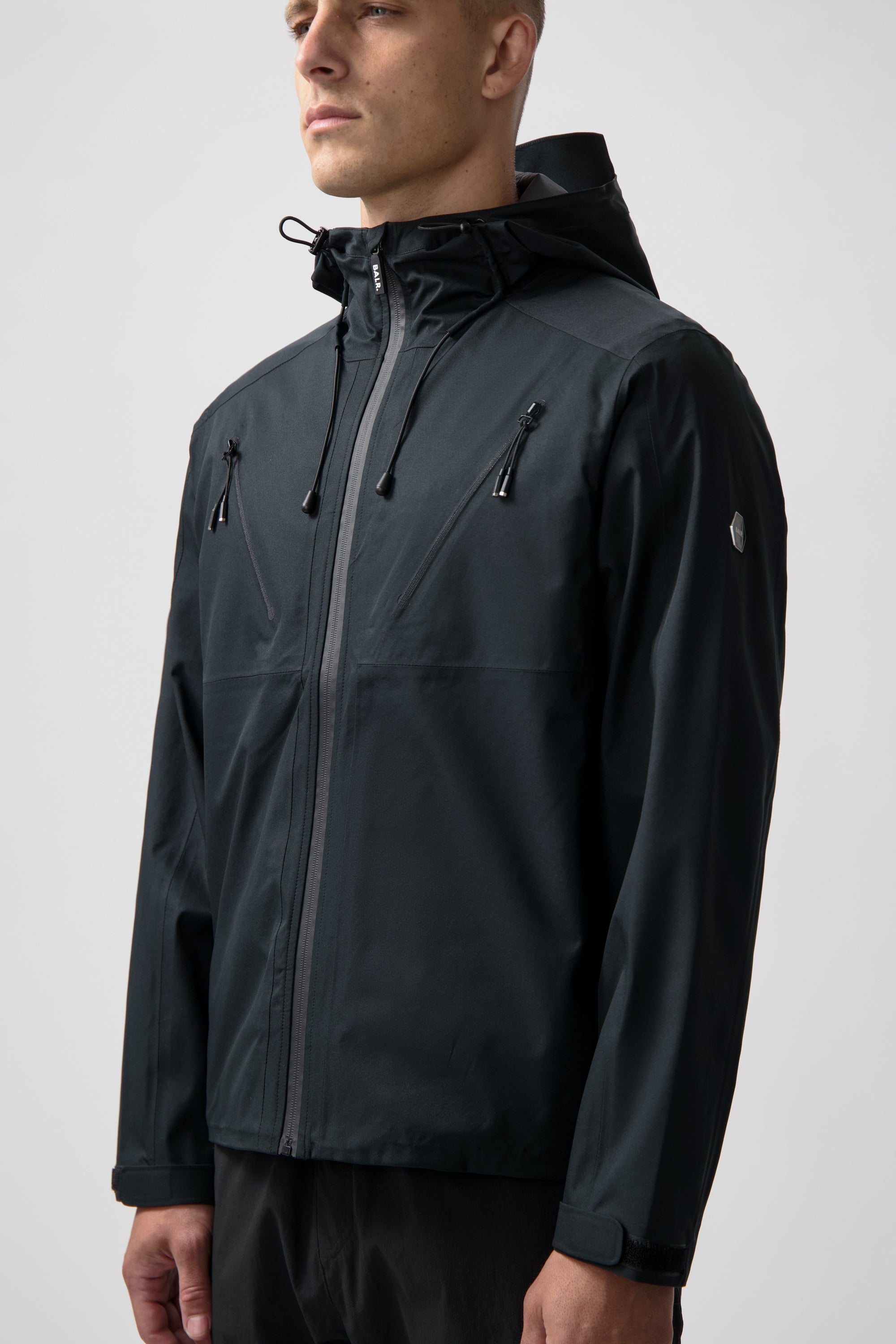 Hex Chaqueta para lluvia de insignia Jet Black