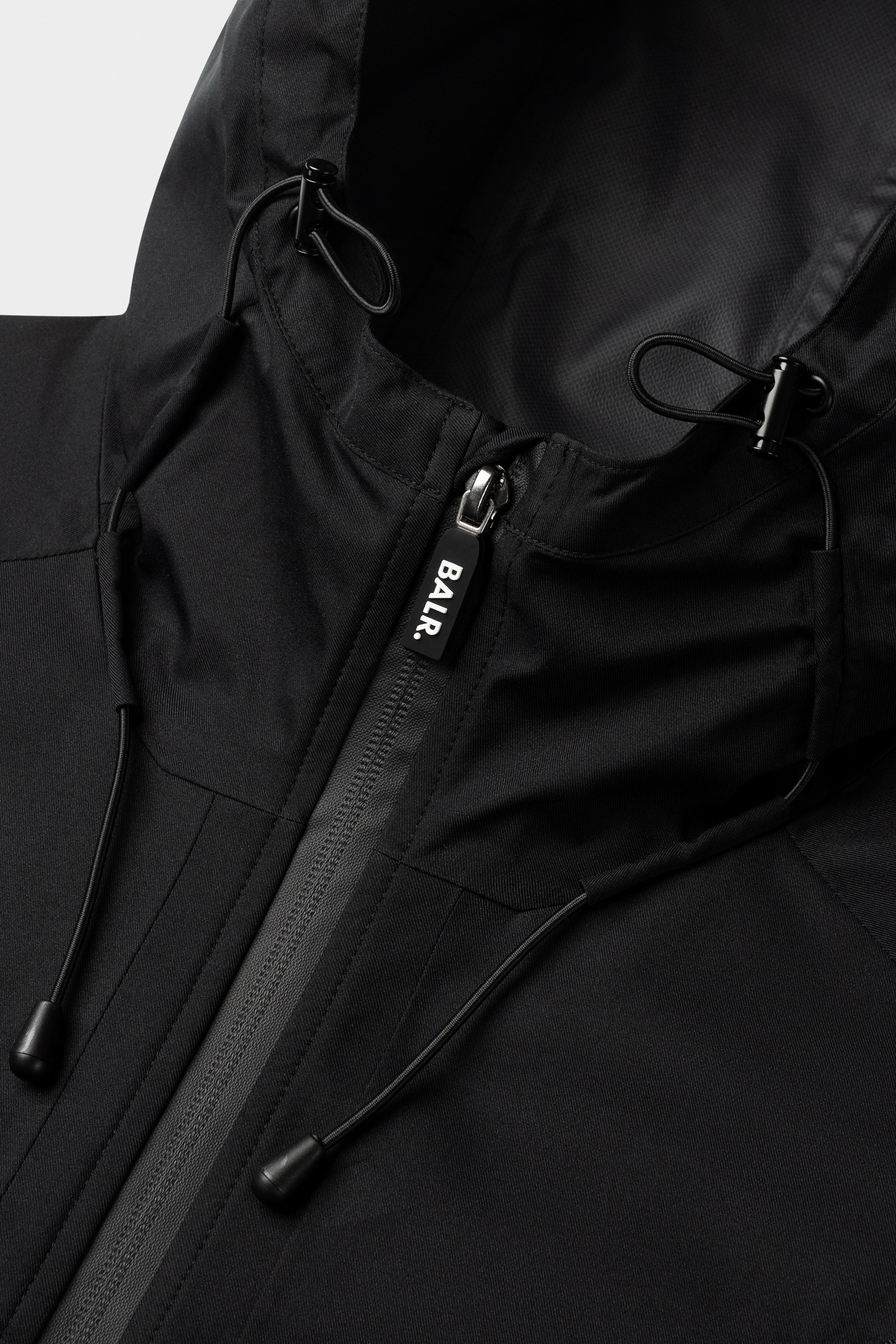 Hex Chaqueta para lluvia de insignia Jet Black